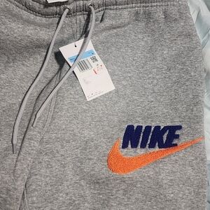 Nike Kids Gray Joggers with Orange and Blue Logo